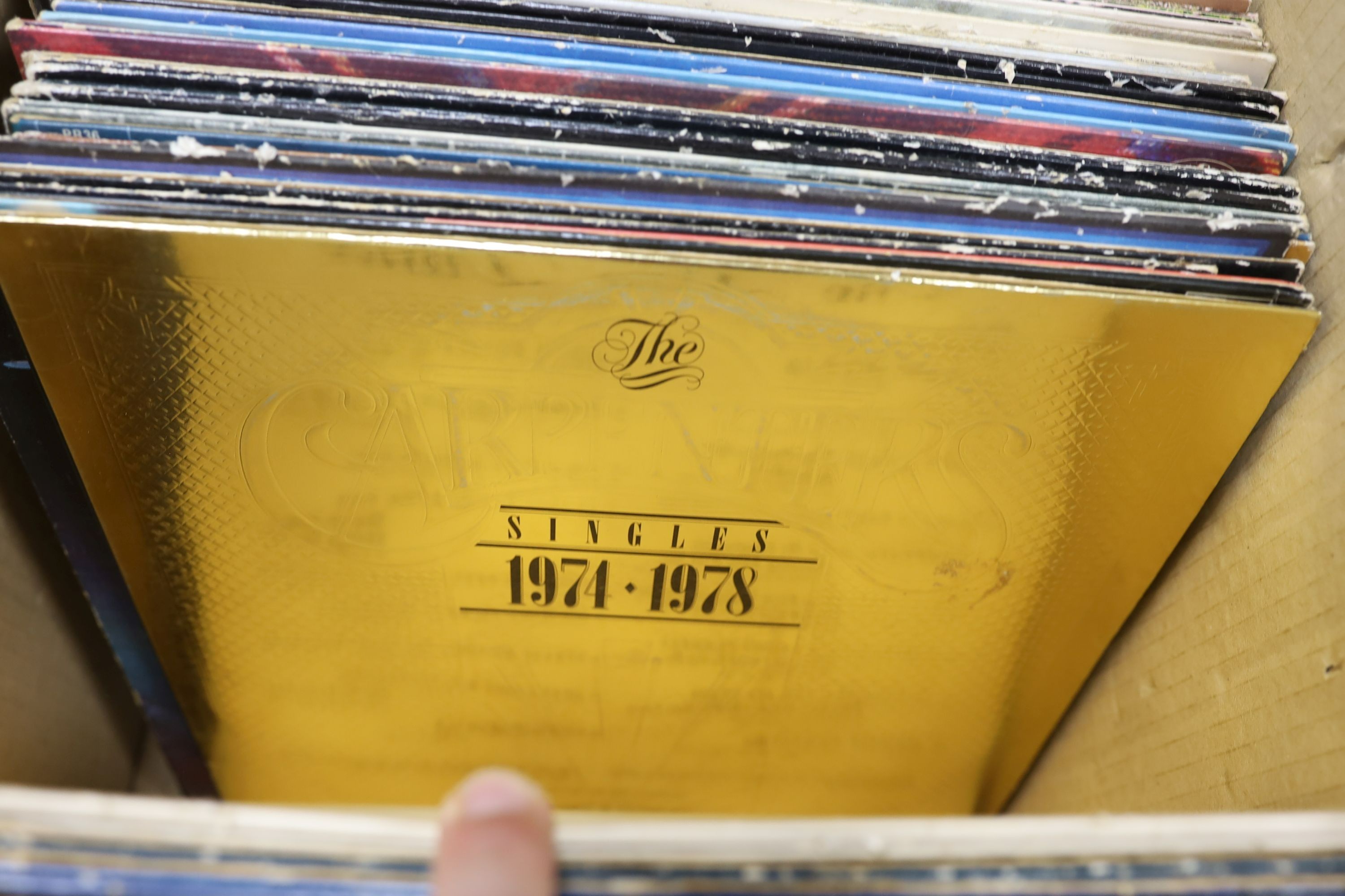 A collection of approximately 87 vinyl LPs to include The Beatles, David Bowie, Traffic, 10CC, Carly Simon etc